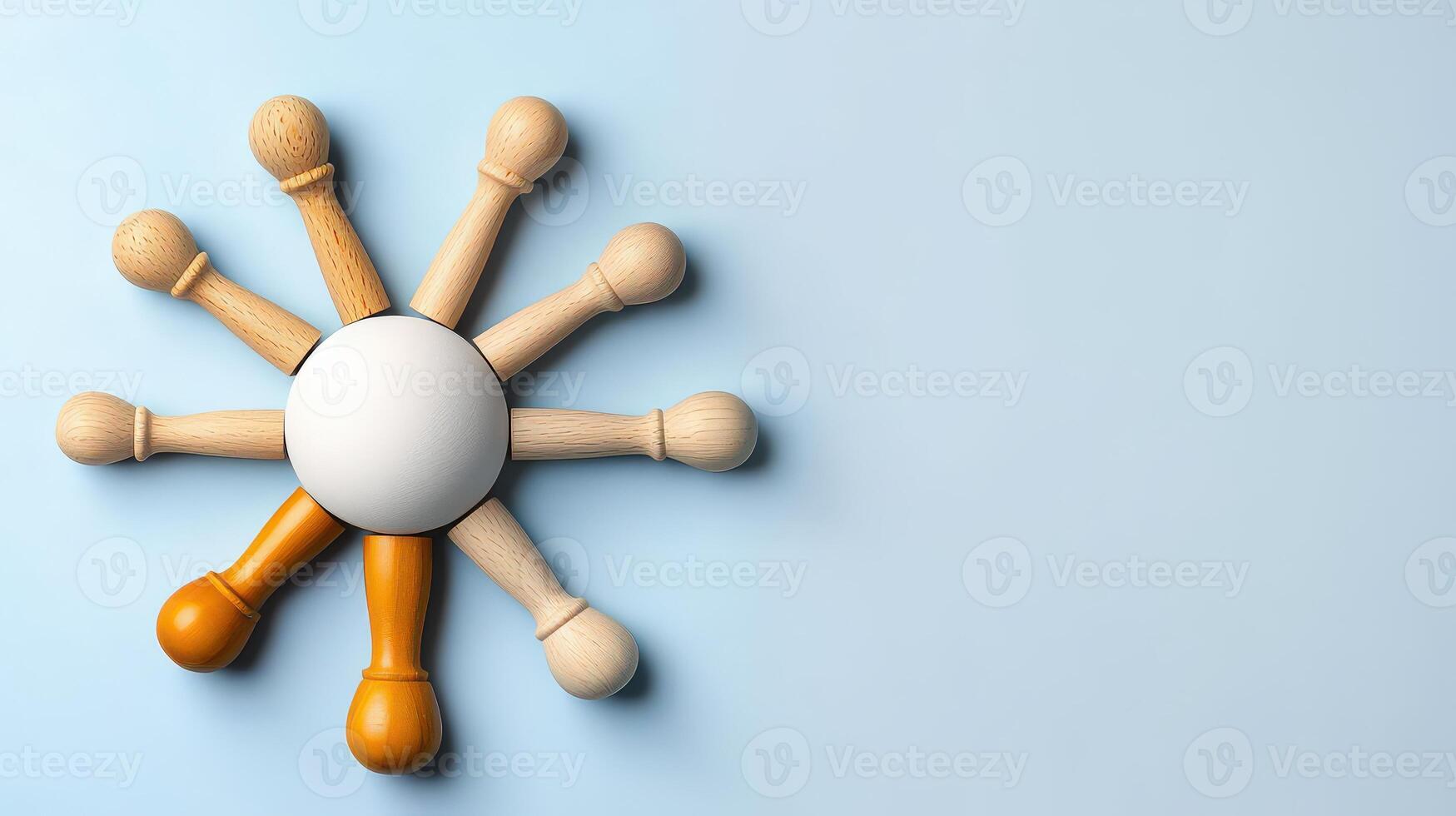 A group of wooden pins are arranged in a circle photo