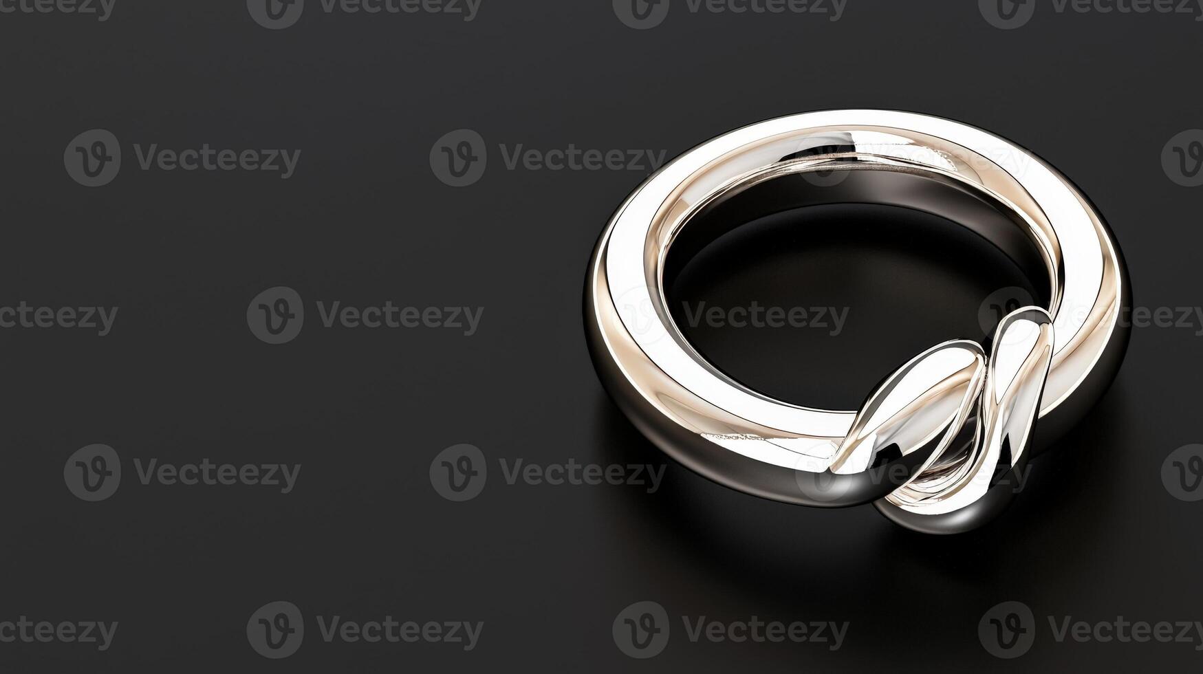 A silver ring with a knot on it photo