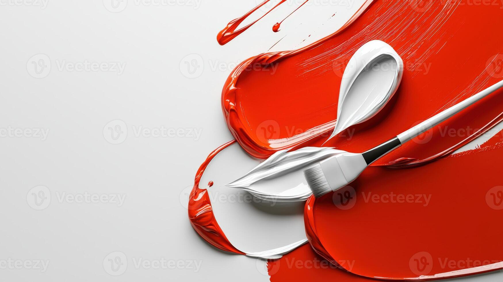 A paint brush and paint are being used to create a red background photo