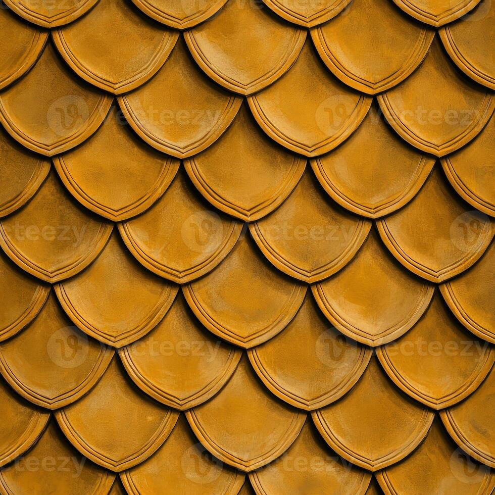 A close up of a gold metal wall with many different shapes photo