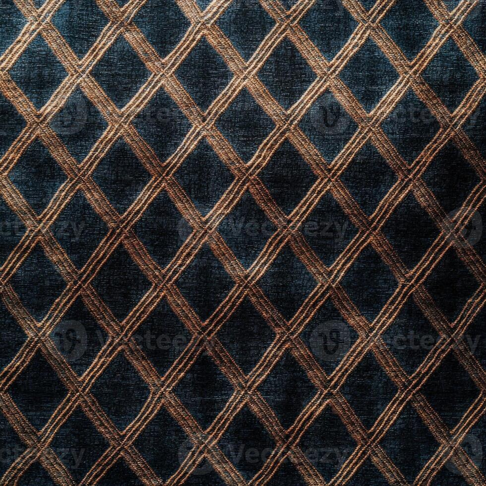 A dark blue and gold rug with a diamond pattern photo