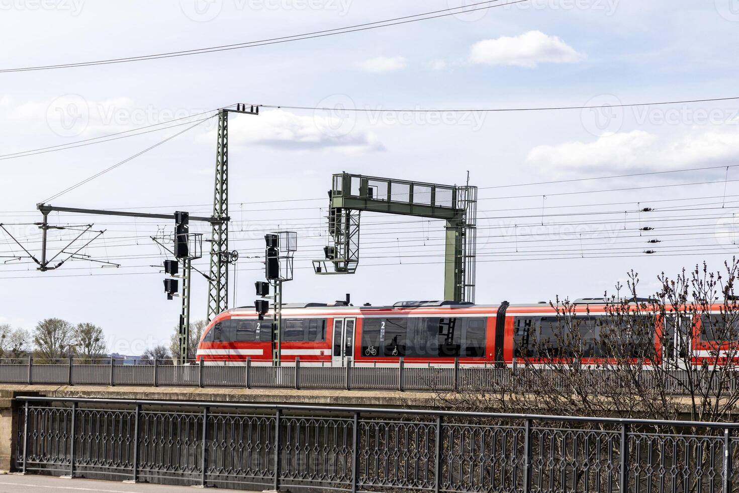 Railway bridge and high-speed train across the Elbe River, Dresden, Germany photo