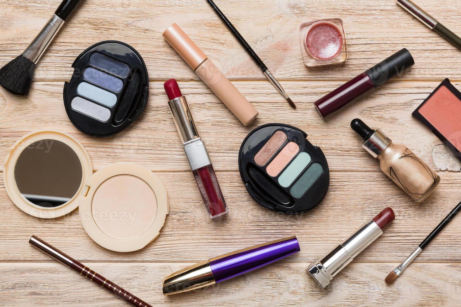 Professional makeup tools. Top view. Flat lay. Beauty, decorative cosmetics. Makeup brushes set and color eyeshadow palette on table background. Minimalistic style photo