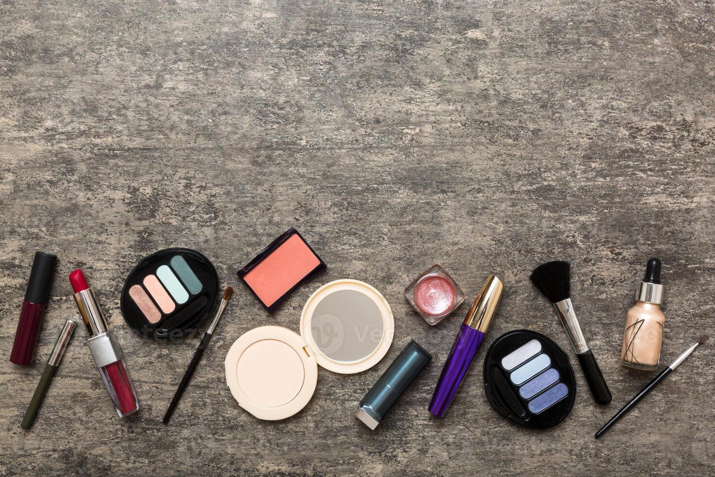 Professional makeup tools. decorative cosmetics. Makeup brushes set and color eyeshadow palette on table background. photo