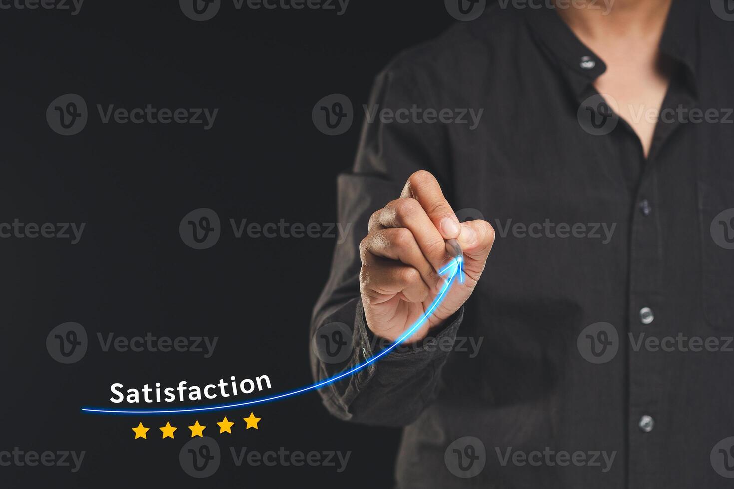 Businessman drawing a line symbol increases satisfaction and feedback while standing on a black background photo