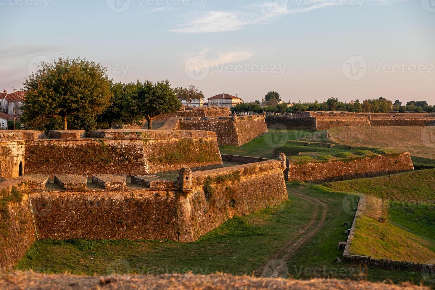 partial view of the walls of the fortress city of Valenca do Minho at sunset, north Portugal photo