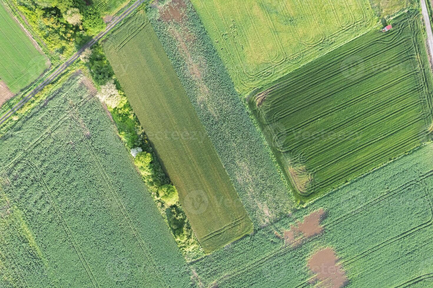 rural landscape with diverse crop fields from above, aerial drone top down view. Agricultural concept background photo