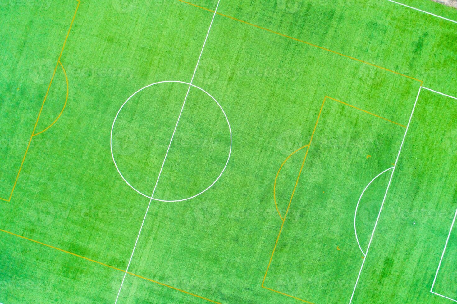 drone top view photography of a synthetic turf sports field overhead view of a soccer football pitch layout photo