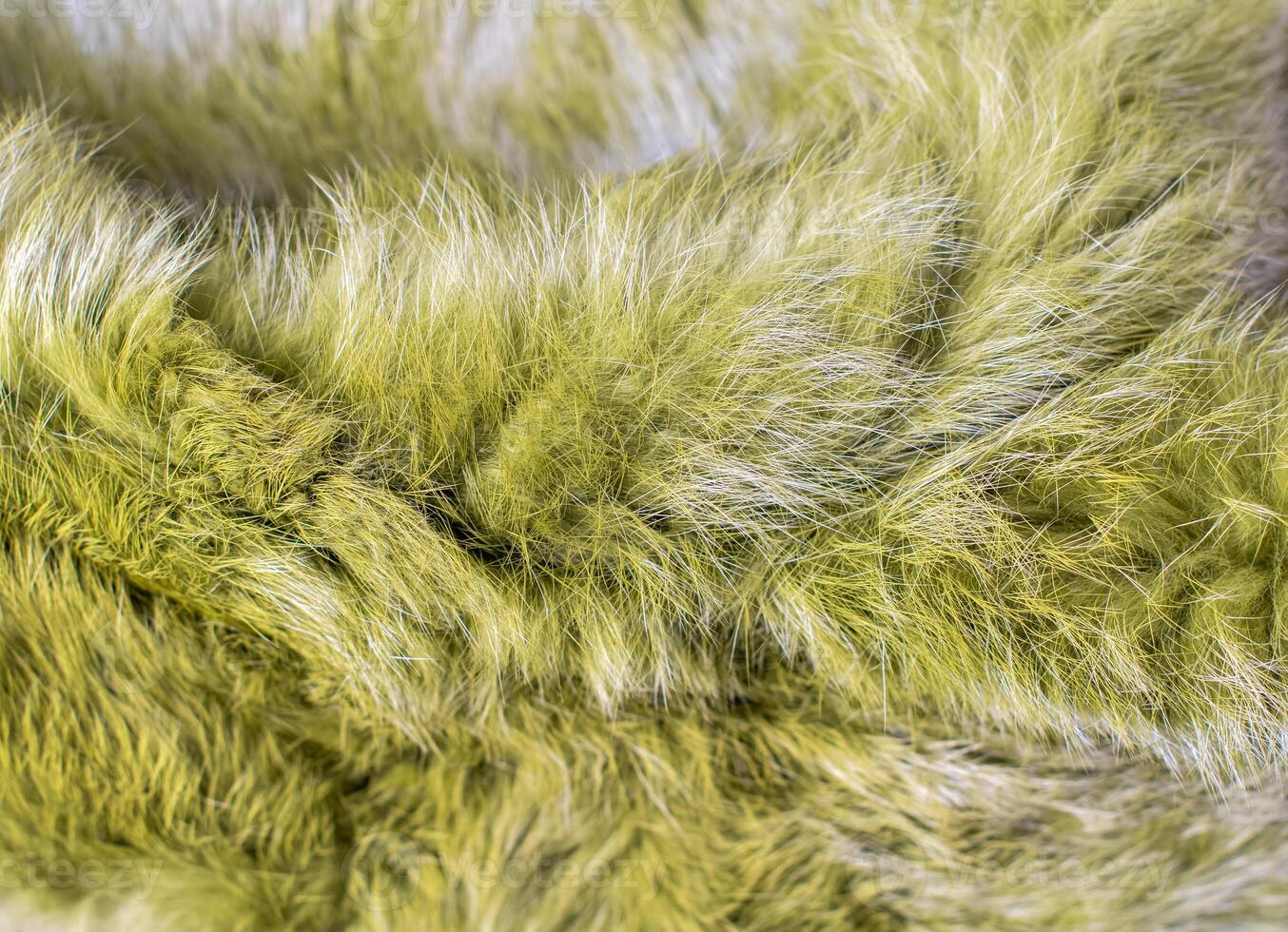 Soft green natural fur texture, fluffy and warm surface, perfect for winter fashion or creating a cozy atmosphere in design, interior, photo