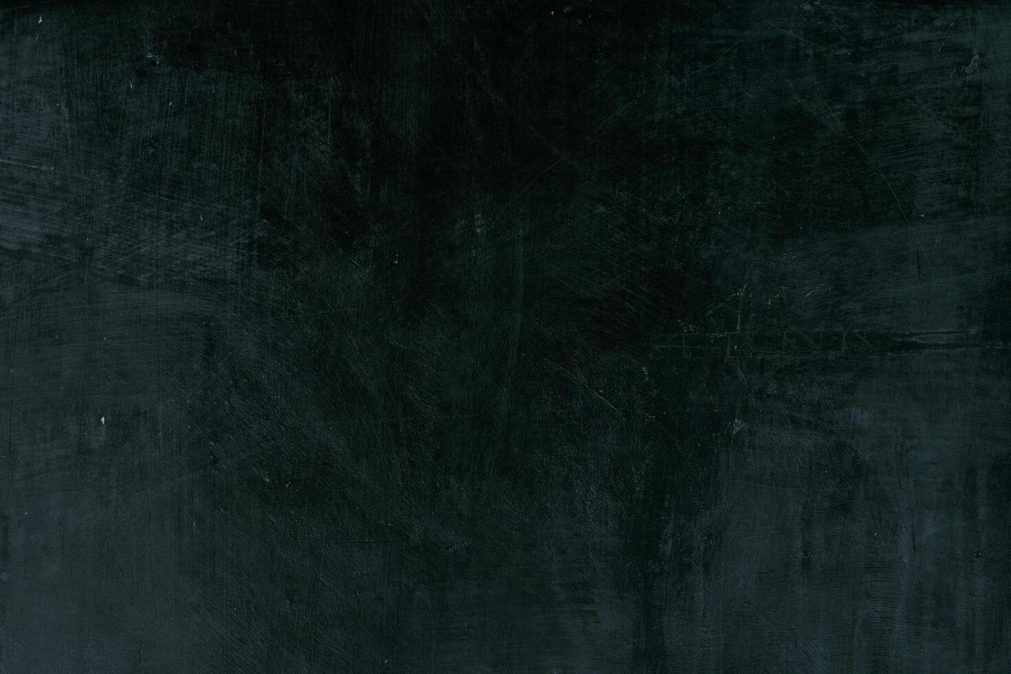 Dark grey black slate scratch background or texture. photo