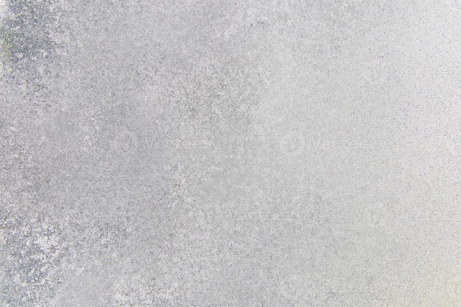 Textured surface of frost covering an outdoor landscape during winter photo