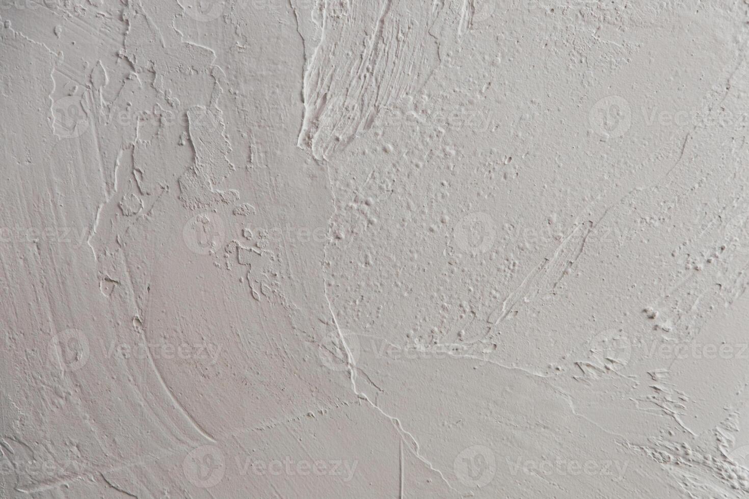 Abstract textured wall surface with subtle variations in white tones and patterns photo