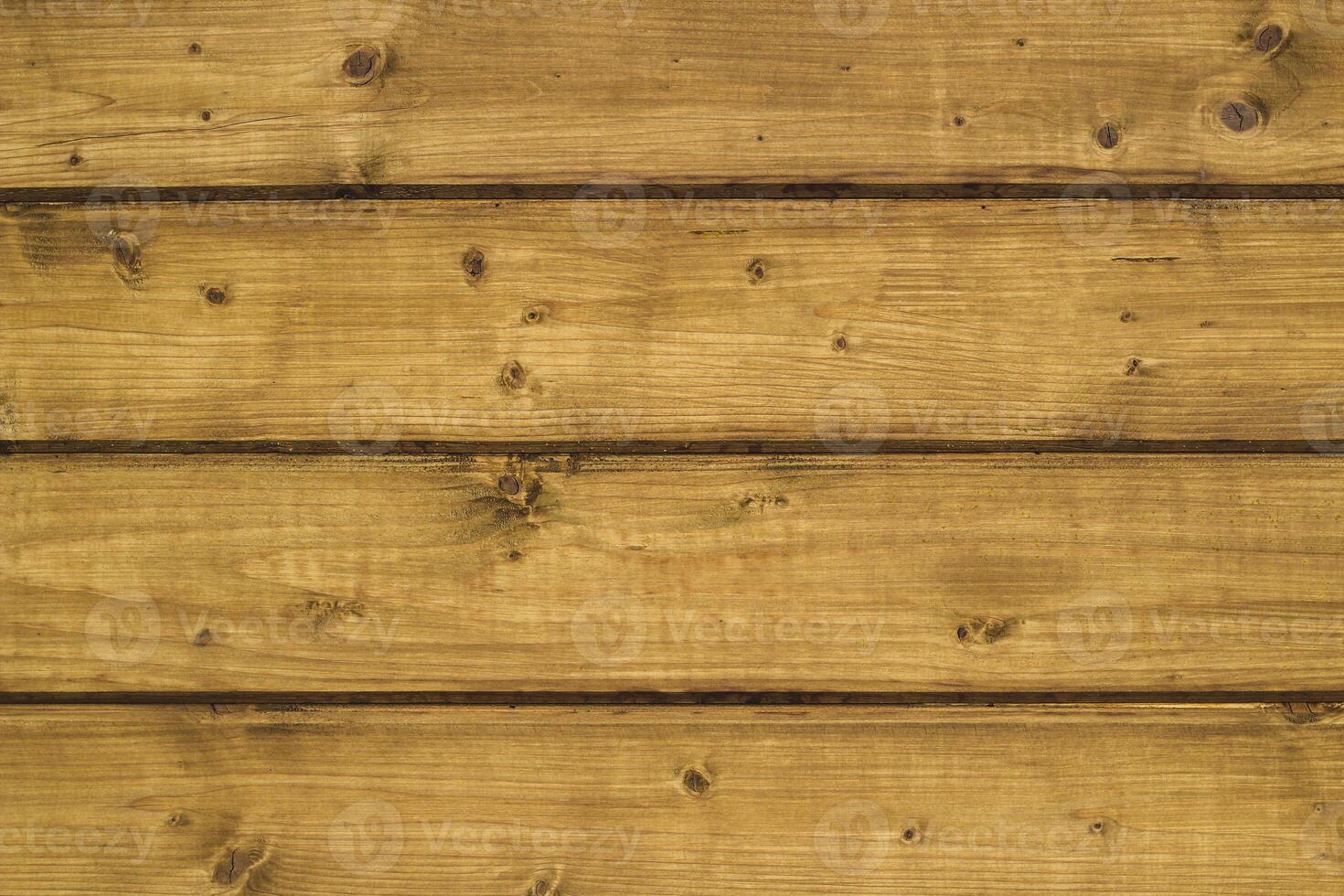 Wooden planks showcasing natural grain patterns in a warm rustic setting photo
