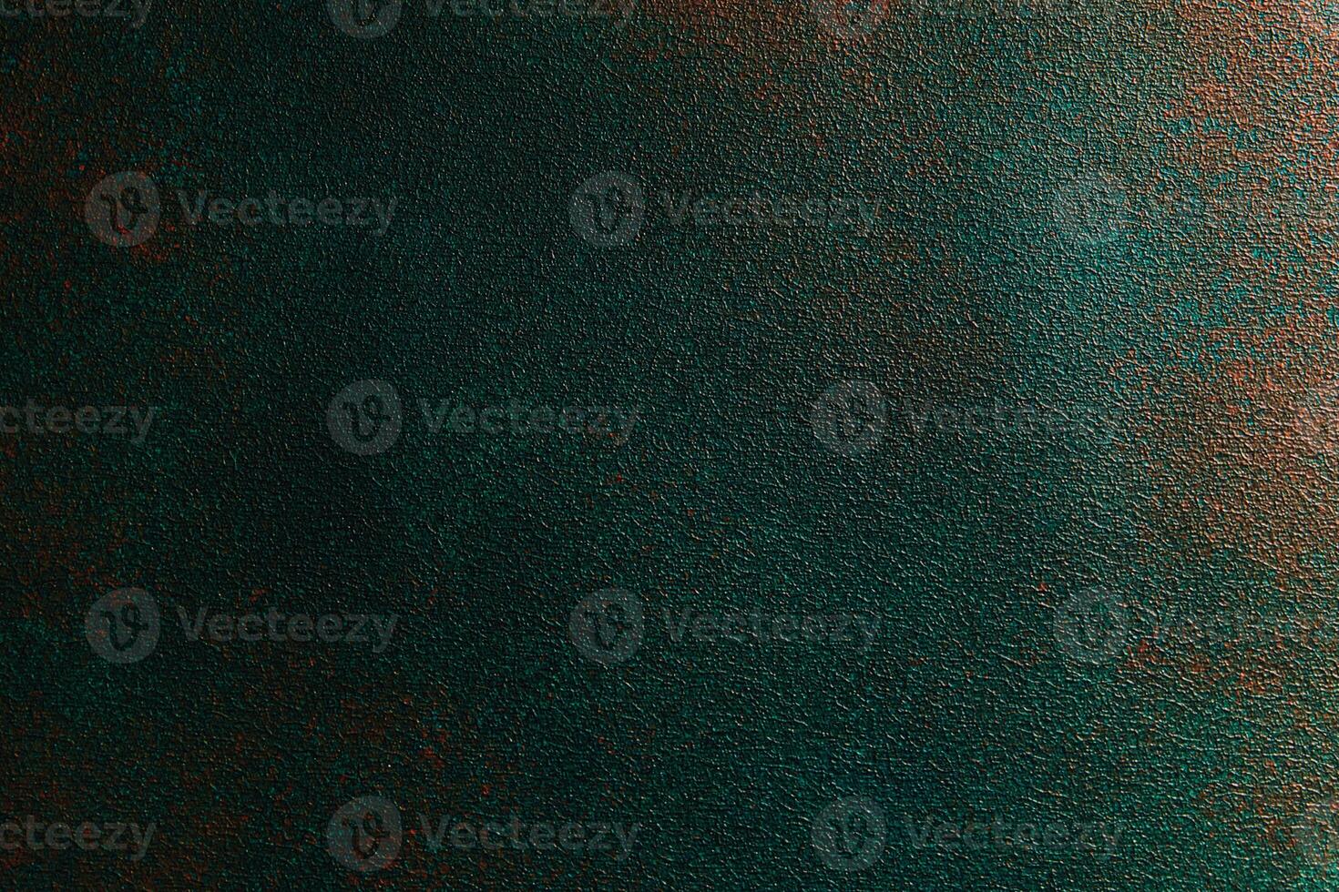 Textured surface with deep green and bronze tones creating an abstract background photo