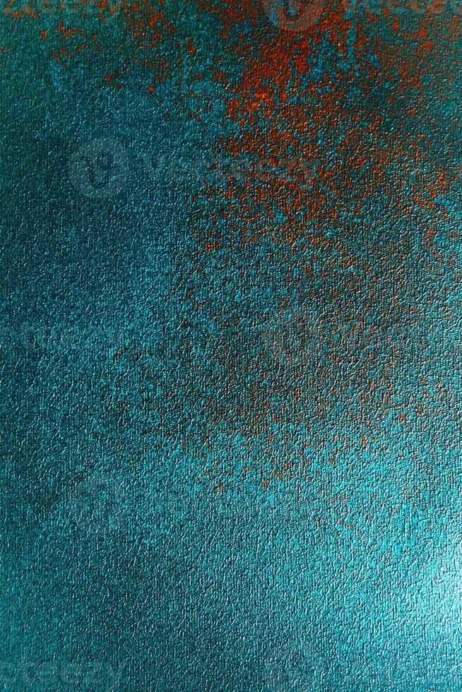 Colorful abstract texture with teal and rust highlights creating a vibrant visual experience photo