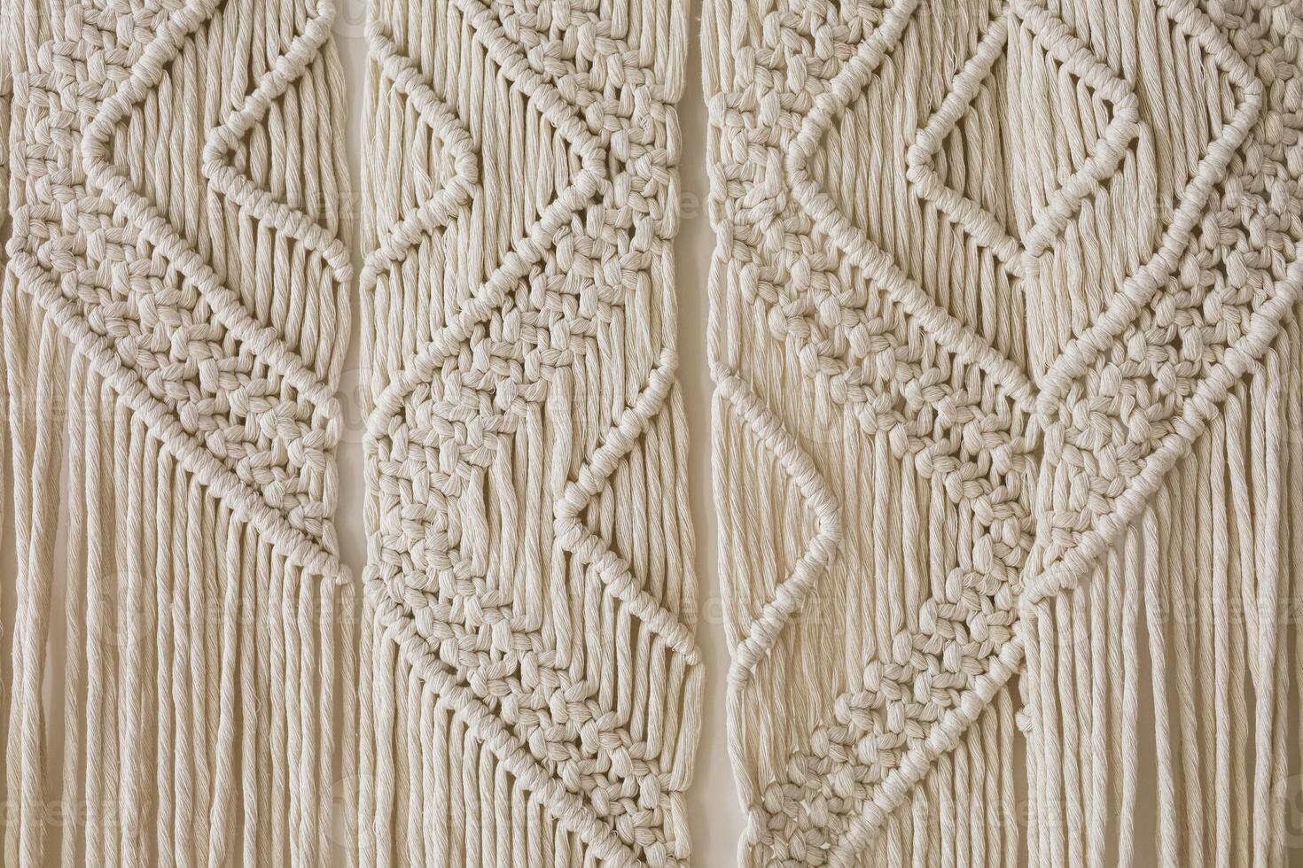 Intricate macrame wall hanging showcasing detailed patterns and craftsmanship photo