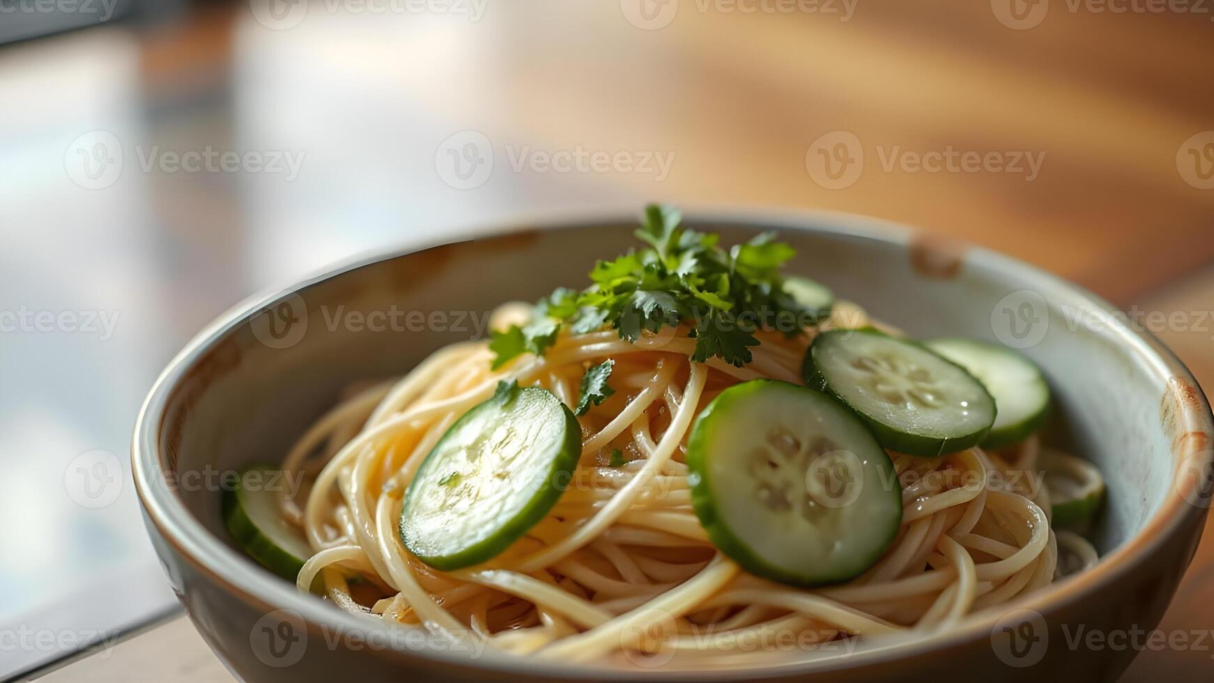 Spaghetti with Cucumber and Parsley in a Bowl photo