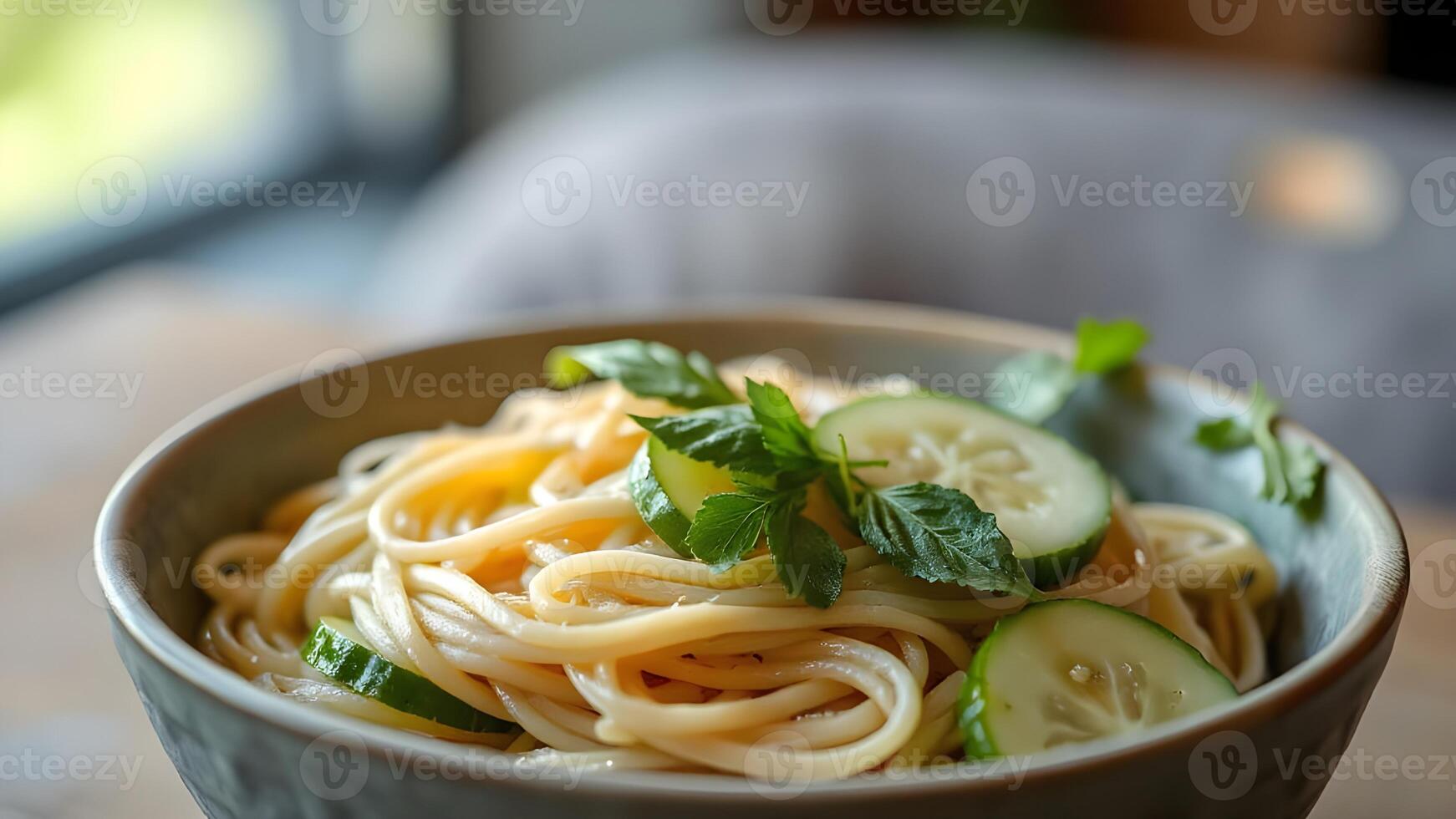 Close-up of a Delicious Pasta Dish with Cucumber and Parsley photo