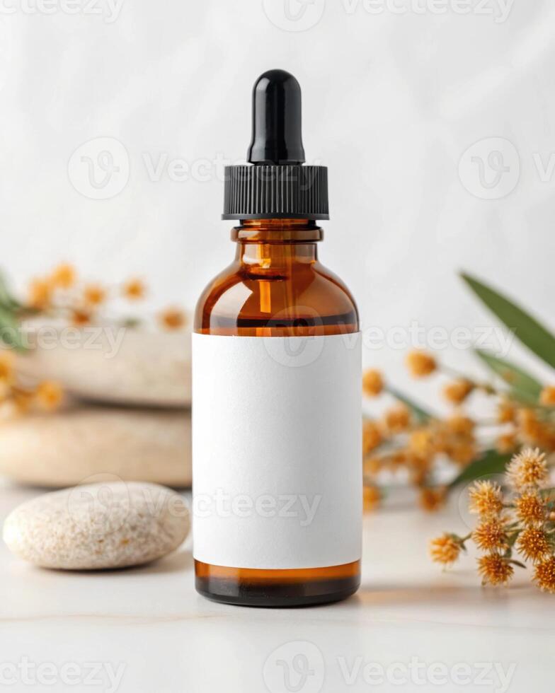 A bottle of essential oil with blank label on a white background photo