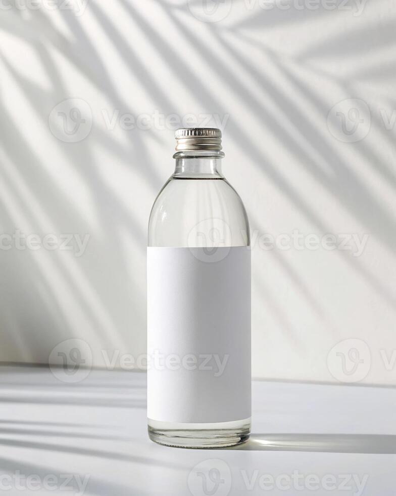 A white bottle with a white label on it photo