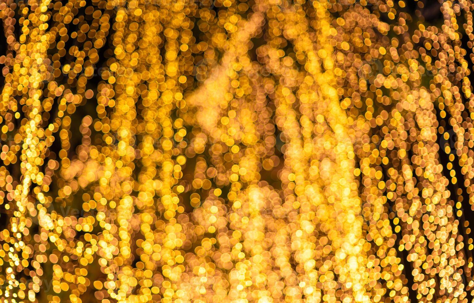 Gold Bokeh Lights Abstract Background. bokeh background with bright lights on night background photo