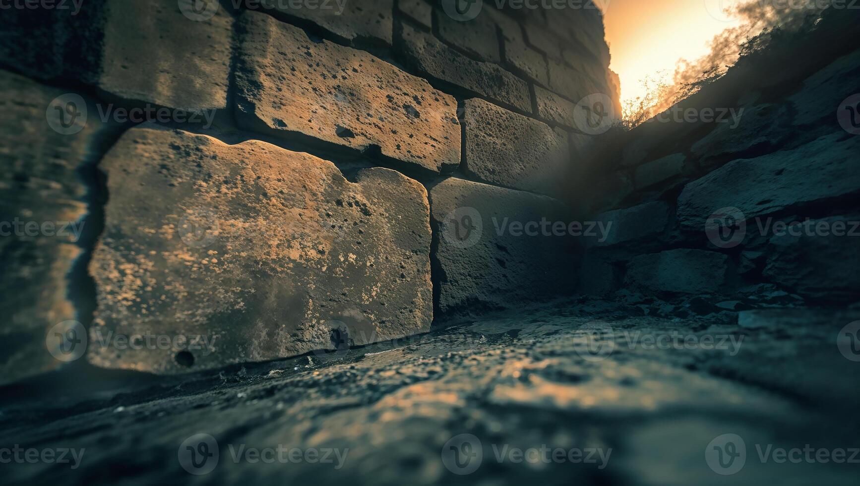 Ancient stone wall illuminated by sunset light photo