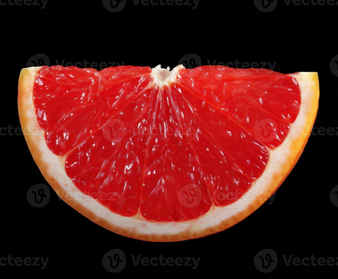 Fresh red grapefruit slice on a dark background for culinary design photo