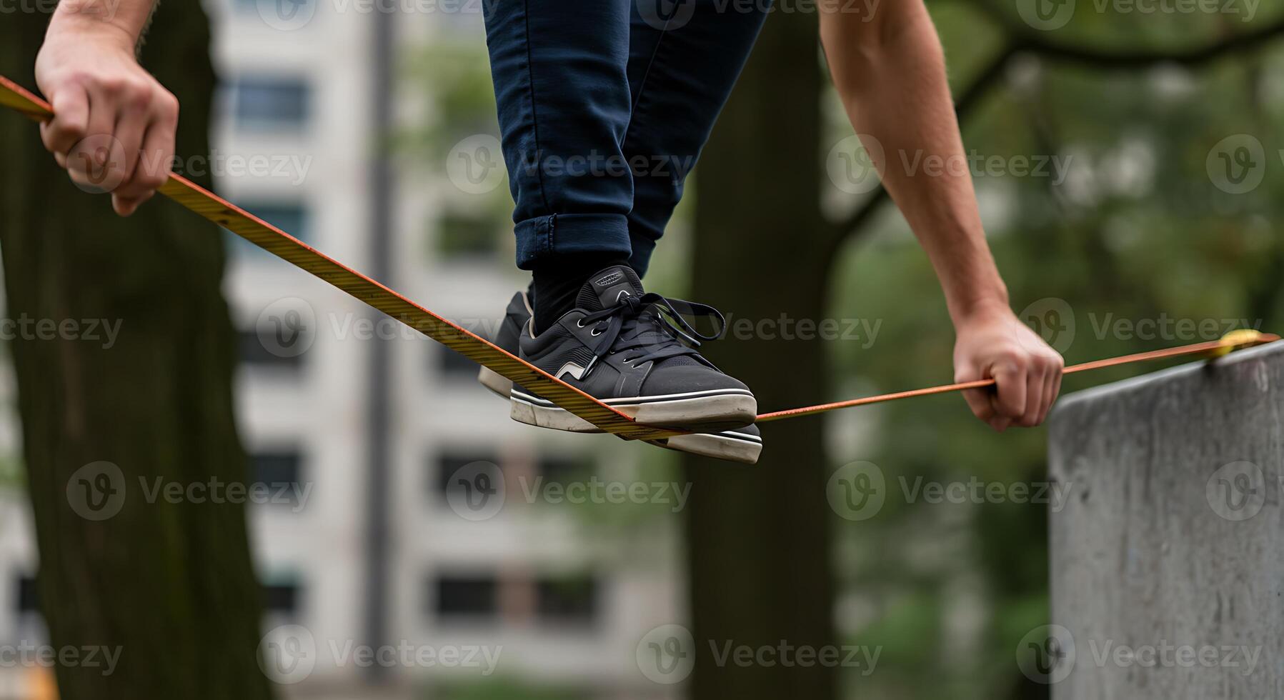 A person balancing on a rope in a park photo