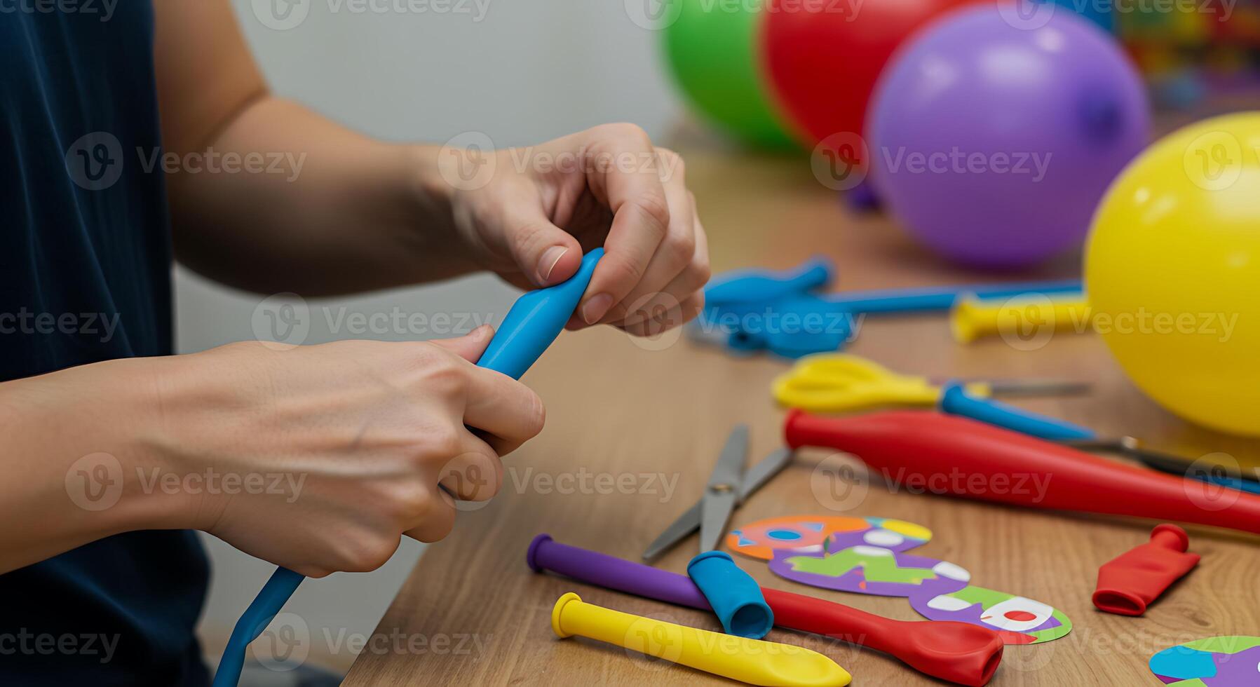 A person cutting a balloon photo
