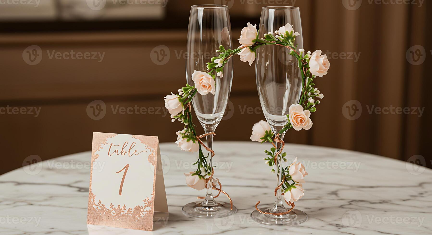 Two champagne flutes with roses on them photo