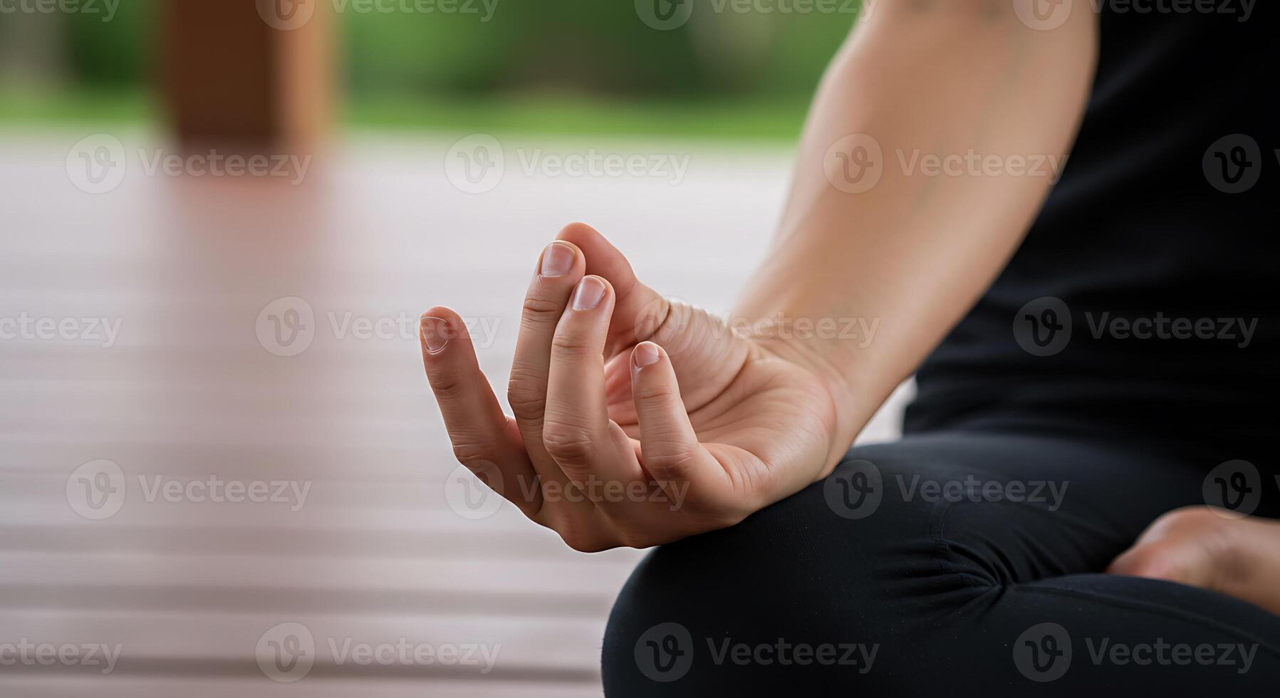 A woman is sitting in a yoga position photo