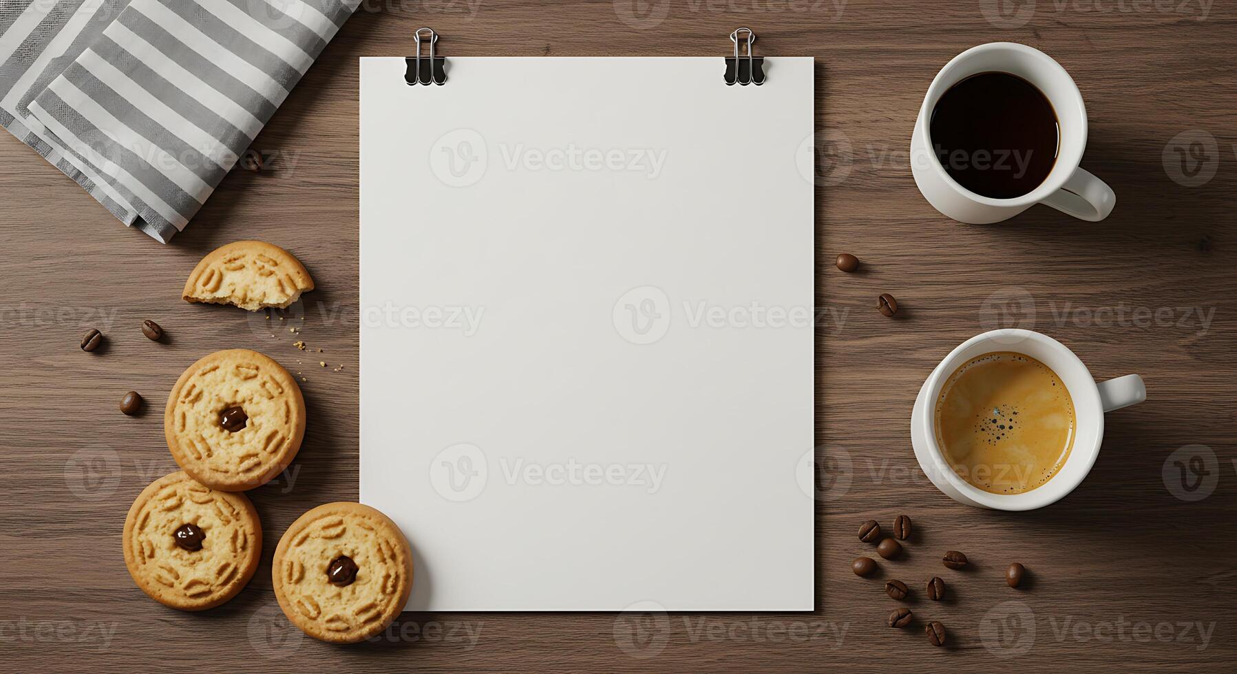 Blank paper with coffee and cookies on a wooden table top view photo
