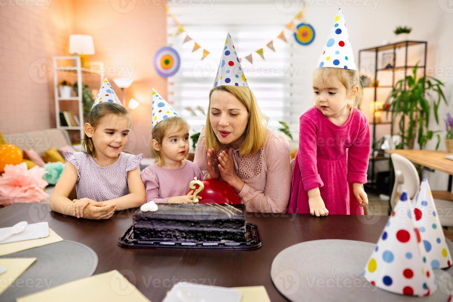 Celebrating a joyful birthday party with family and cake photo