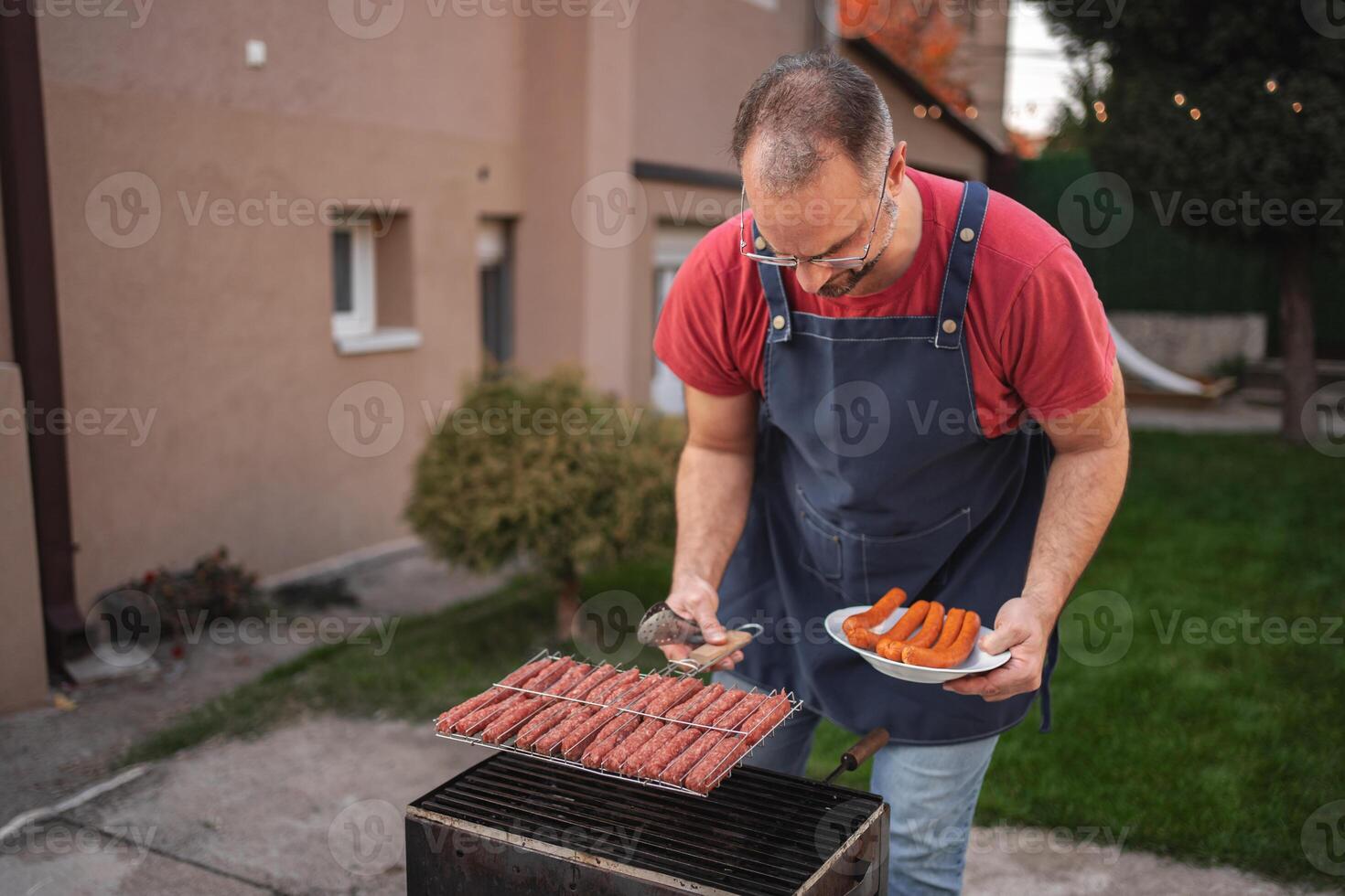 Grilling delights at a cozy backyard gathering with friends and family photo