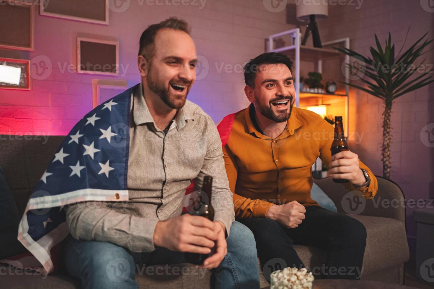 Friends Enjoying Game Night at Home with Snacks and Drinks Under Warm Lighting photo