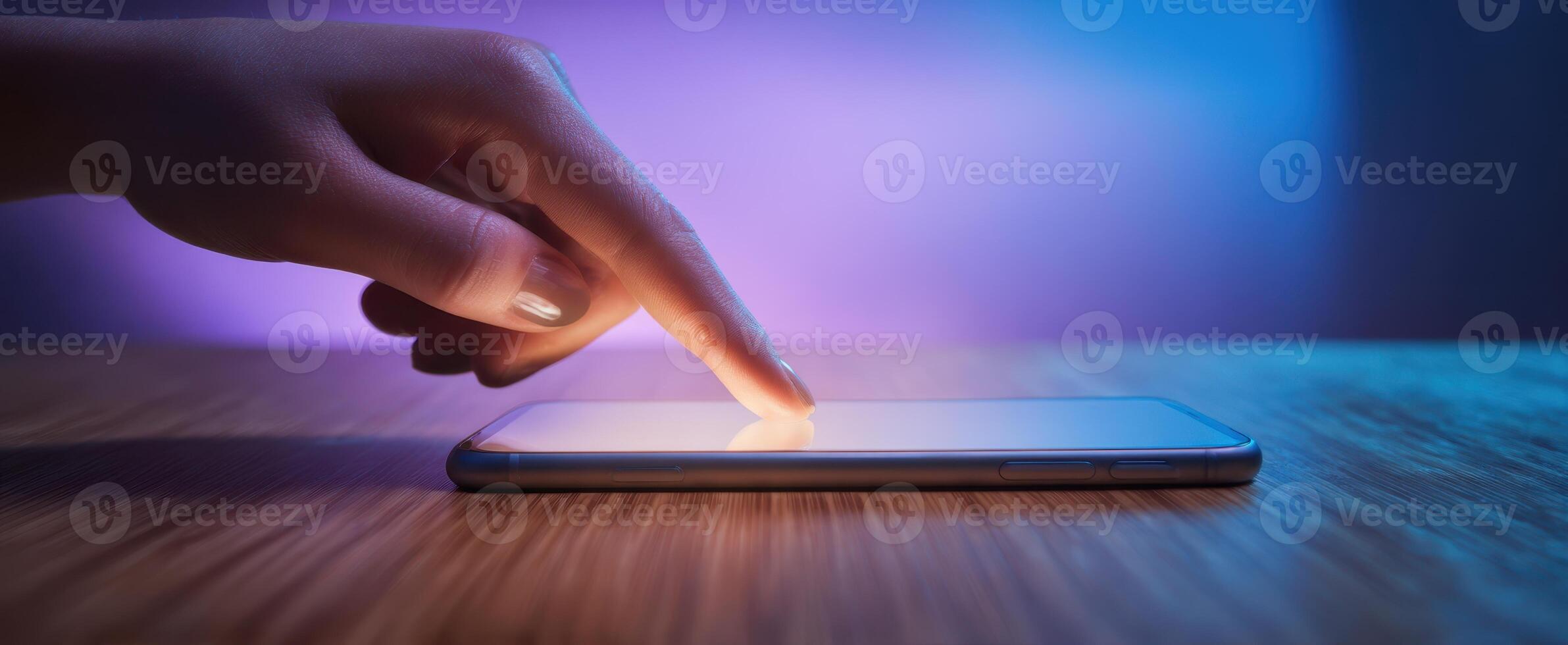 The Hand Interacting with a Smartphone Screen in Ambient Light photo