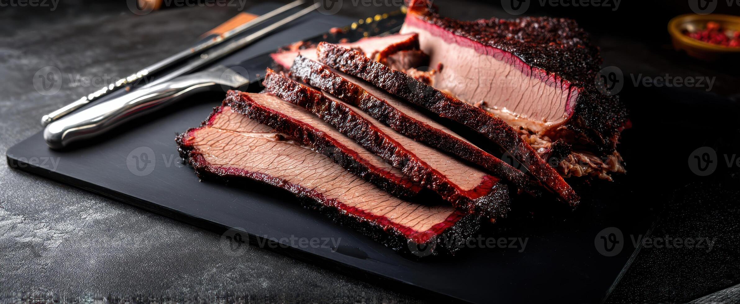 The deliciously smoked brisket sliced to perfection on a rustic platter photo