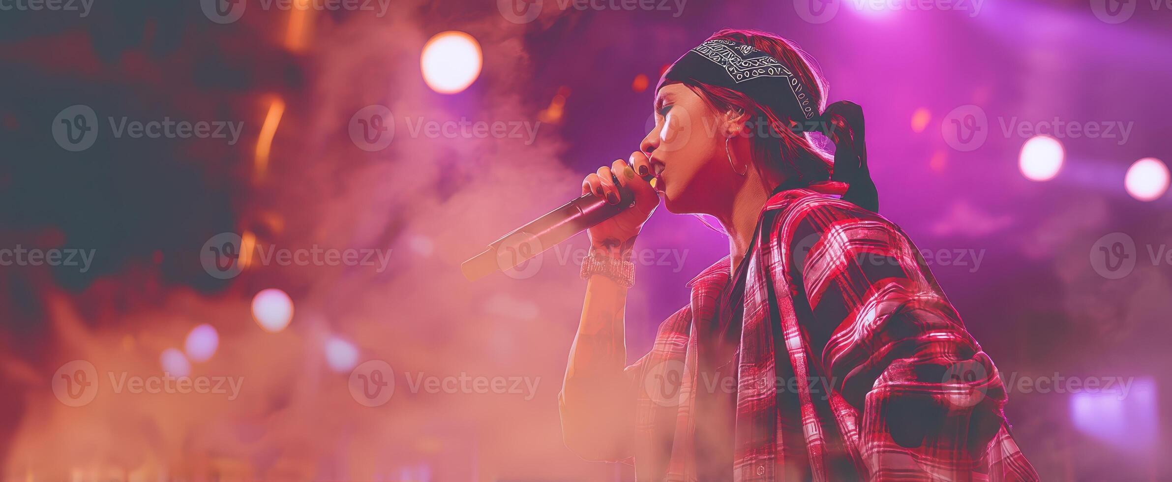 The vibrant singer captivating the audience during a live concert performance. photo