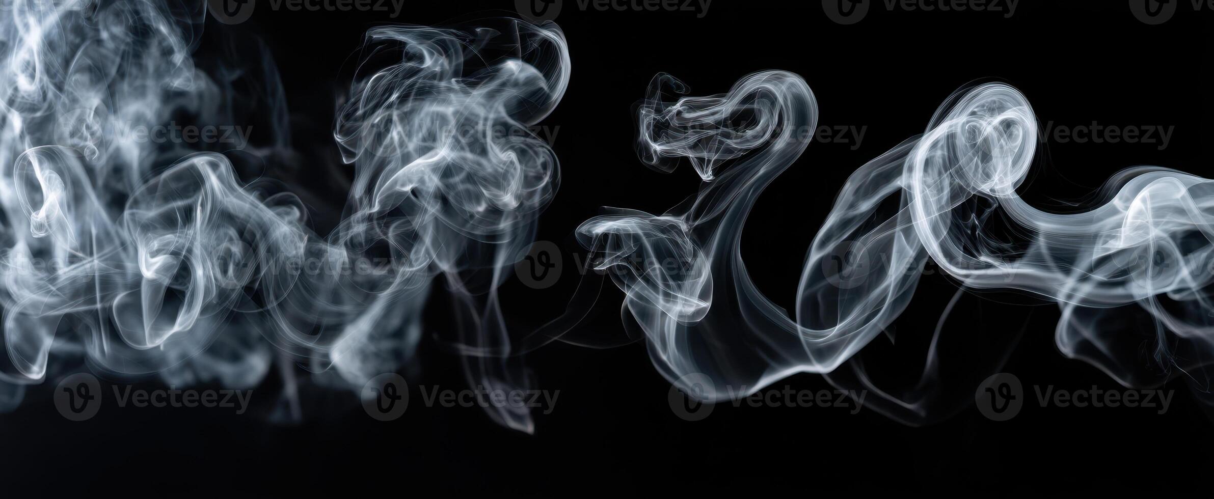 The Fluid Dance of Smoke Against a Dark Background photo