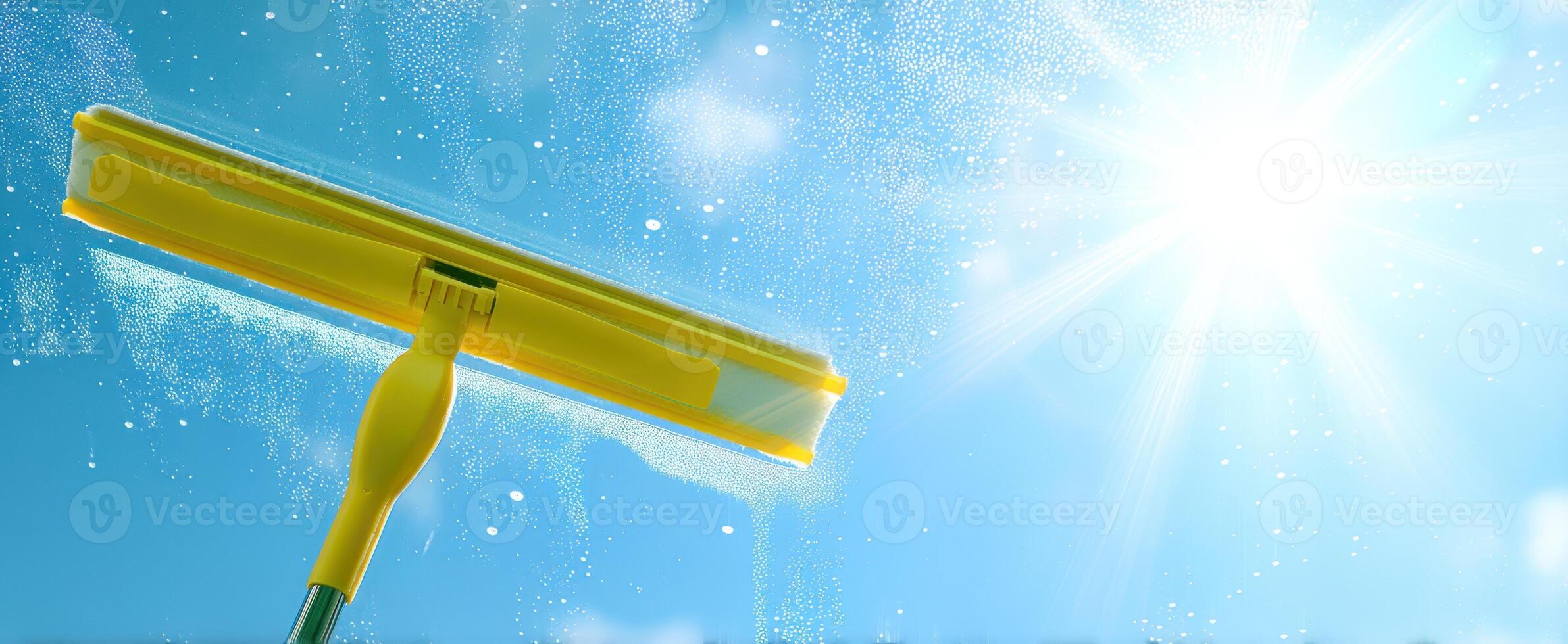 The squeegee enhancing clarity on a sunny day with a sparkling blue sky. photo
