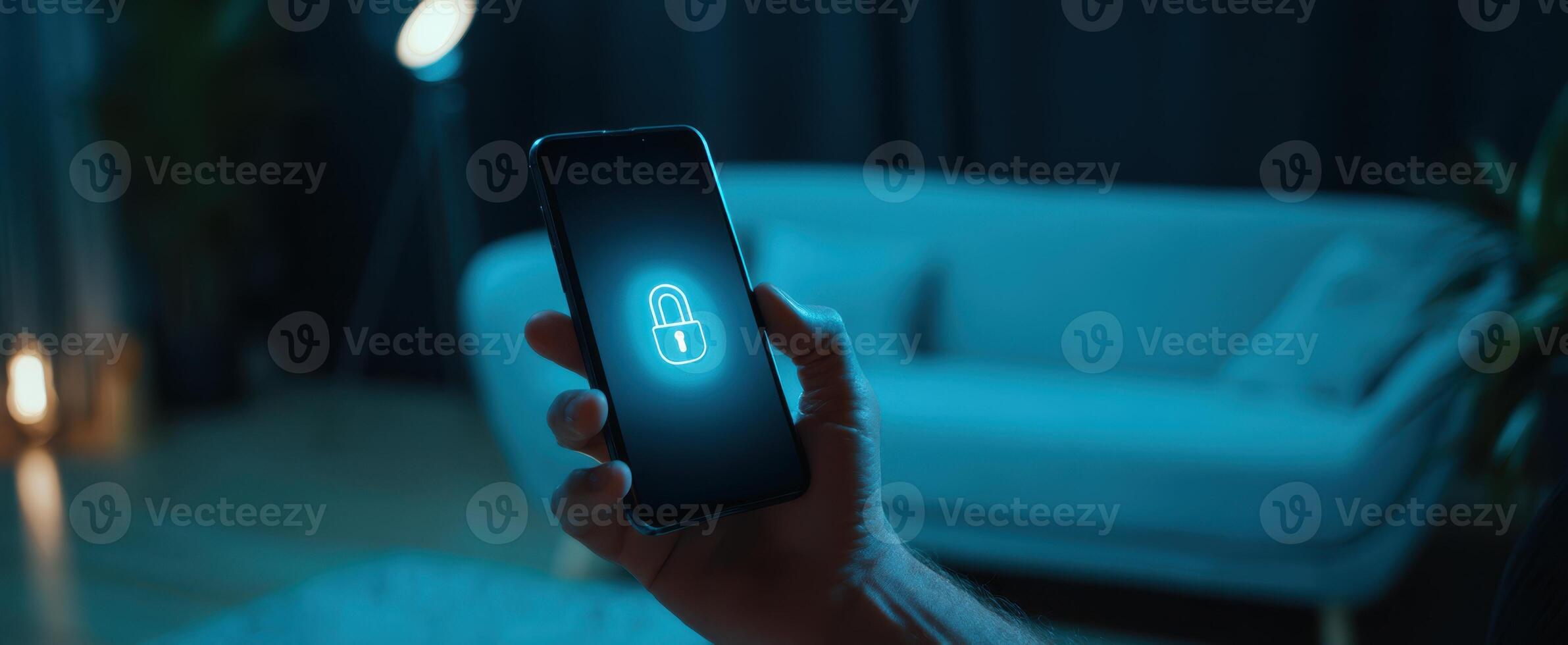 The smartphone displaying a digital lock icon in a cozy, dimly lit room. photo