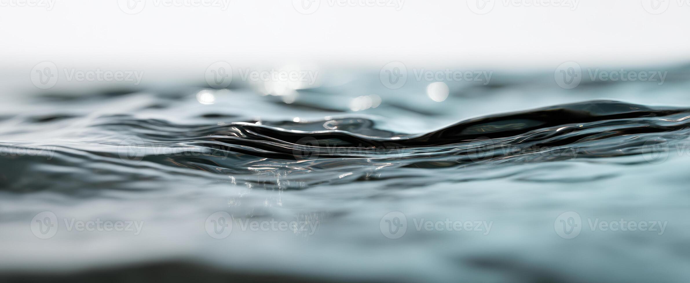 The Gentle Movement of Water Reflecting Light on a Calm Surface photo