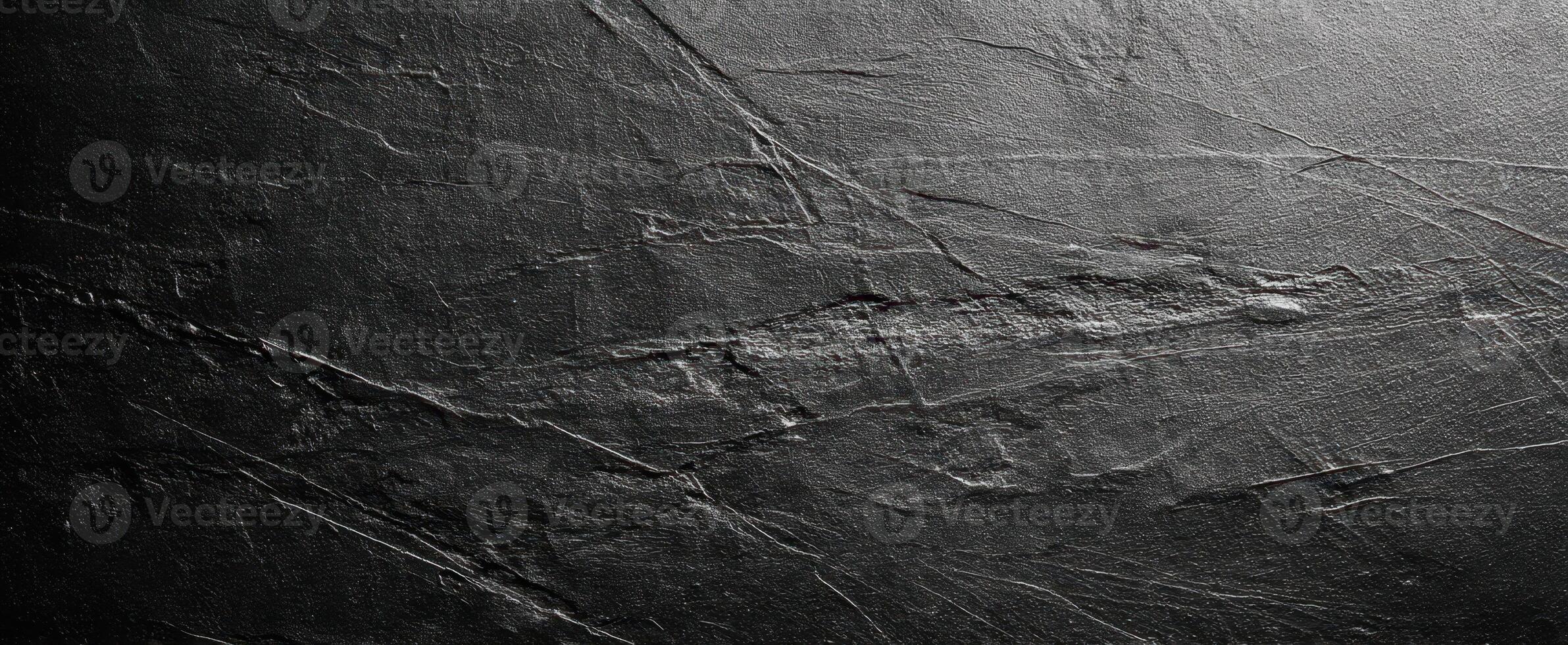 The textured dark surface with intricate patterns and natural elegance. photo