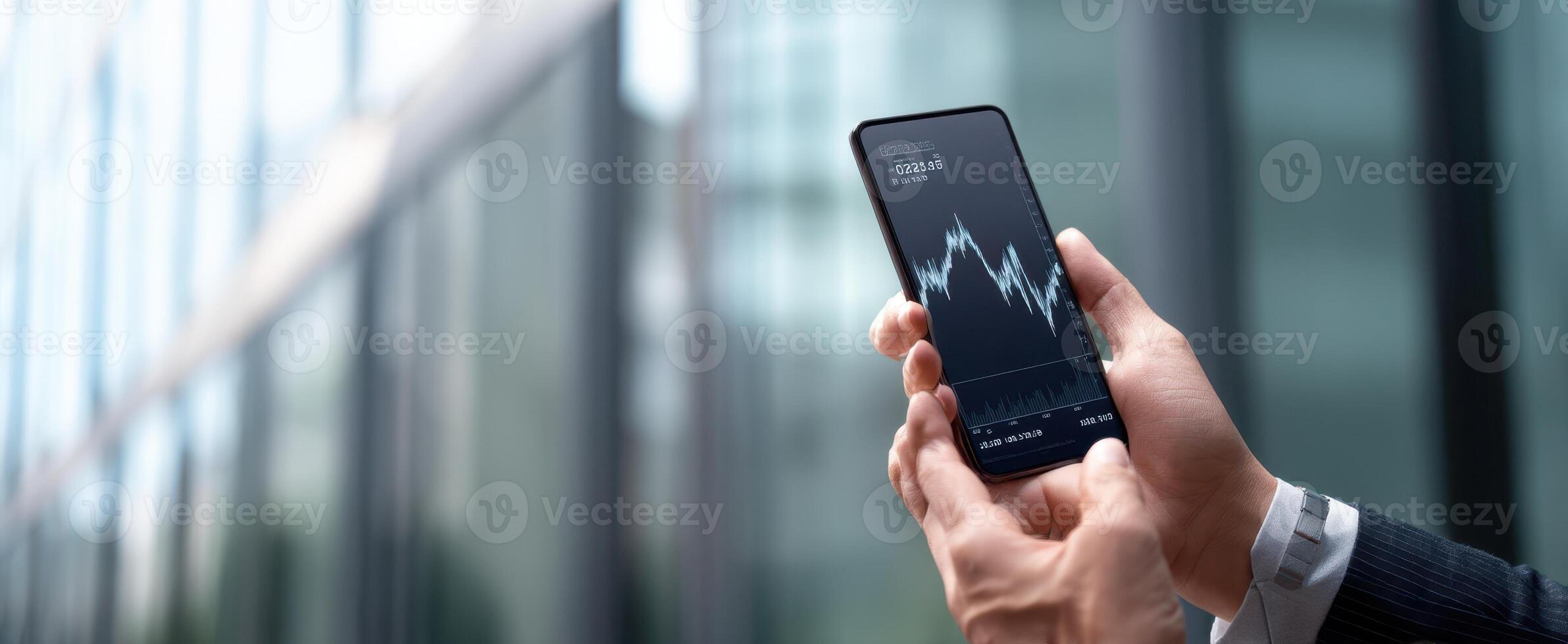 The smartphone displaying financial graphs in a professional setting. photo