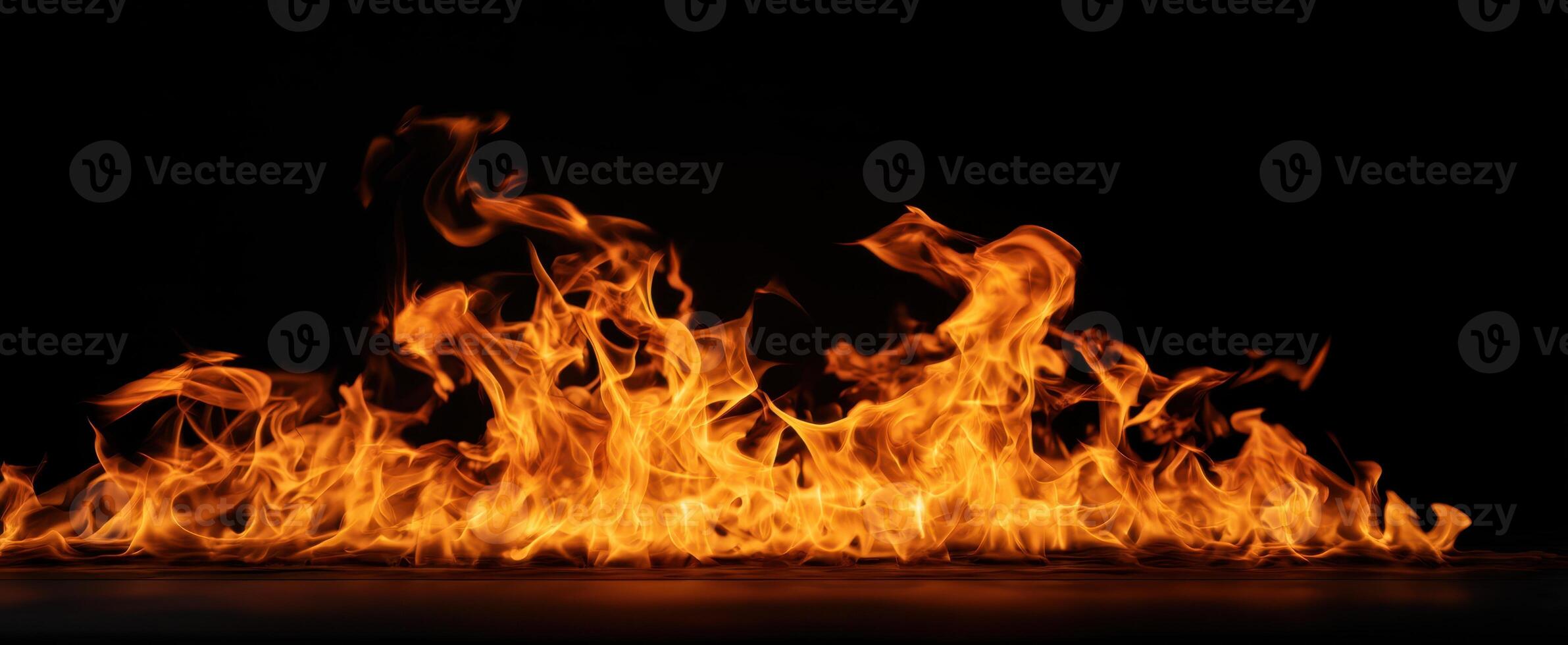 The vibrant flames dancing against a dark backdrop create a mesmerizing display. photo
