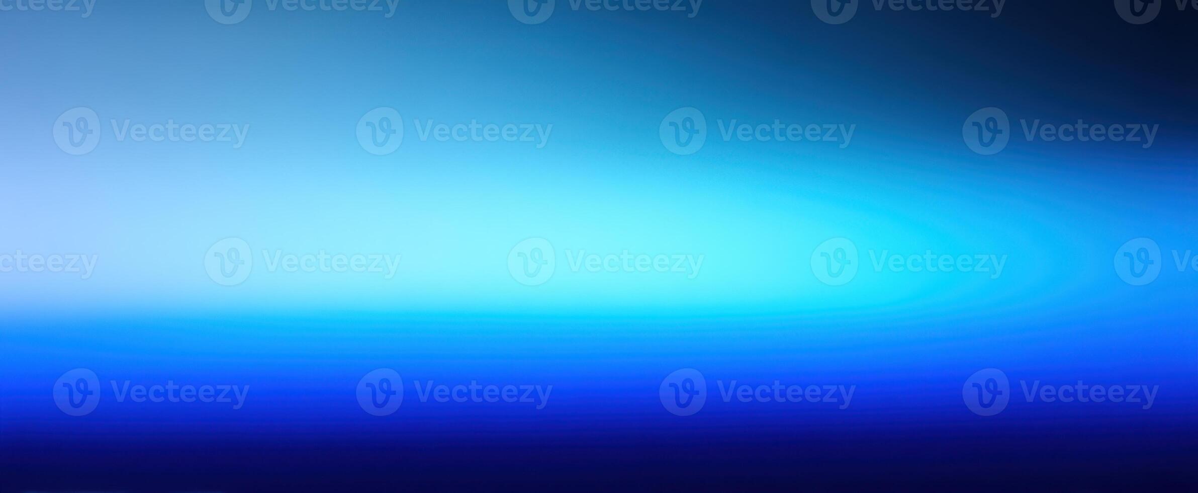 The abstract blue gradient background evokes tranquility and modernity in design. photo
