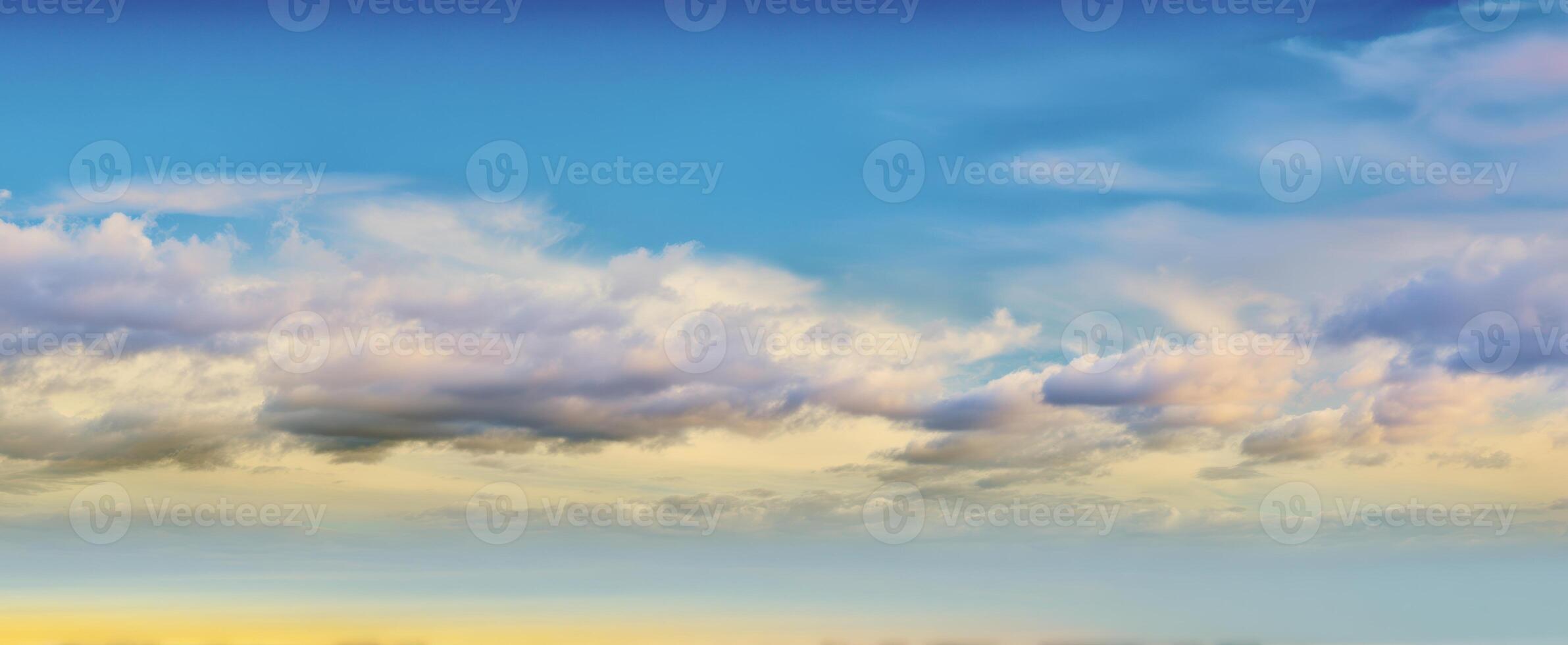 The majestic evening sky filled with colorful clouds and serene hues. photo