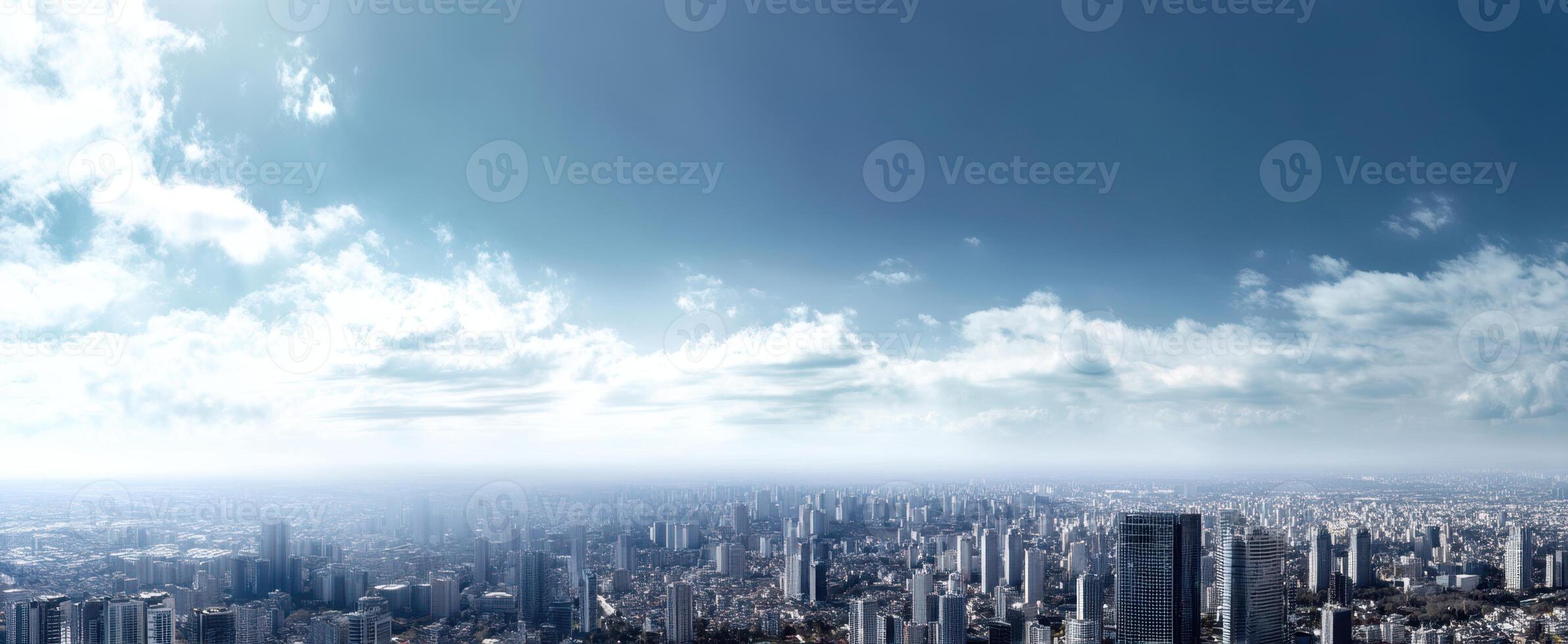 The expansive city skyline revealing a modern metropolis under a clear blue sky. photo