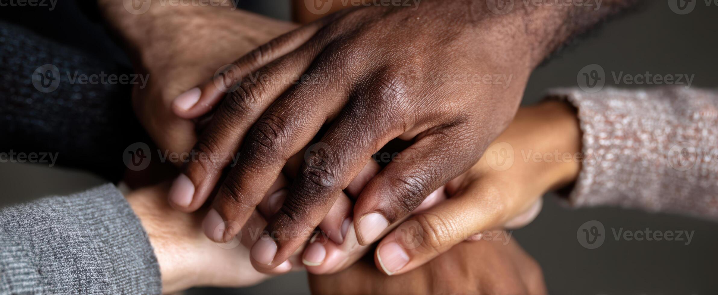 The Hands Together Symbolizing Unity and Collaboration in Diverse Community Settings photo
