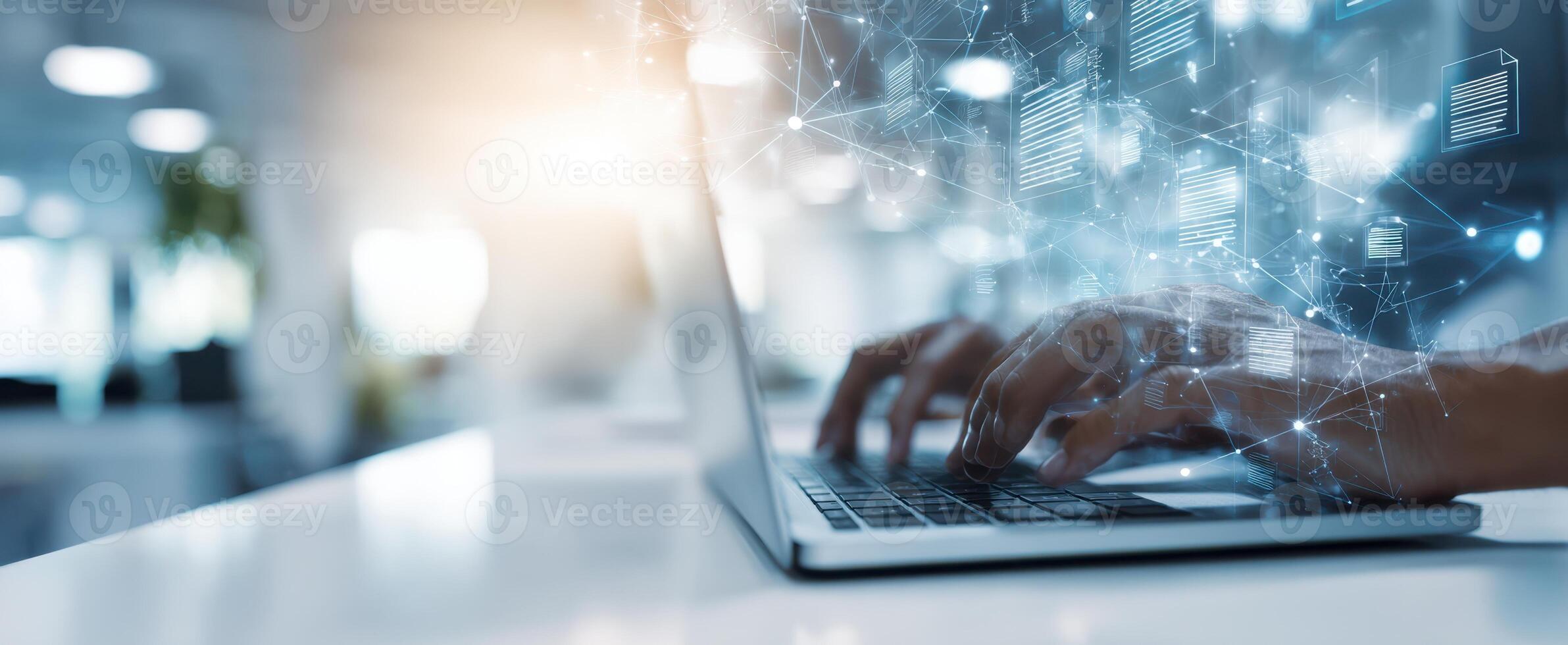 The laptop showing hands typing in a modern digital workspace environment. photo